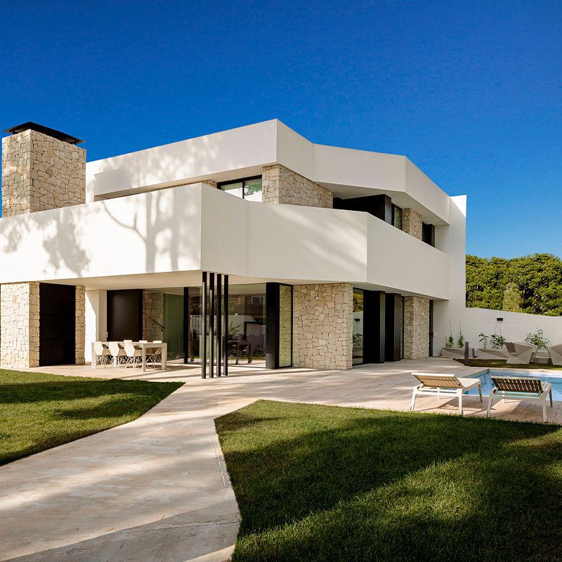 Residential project with outdoor furniture chairs, table and sun loungers by Vondom