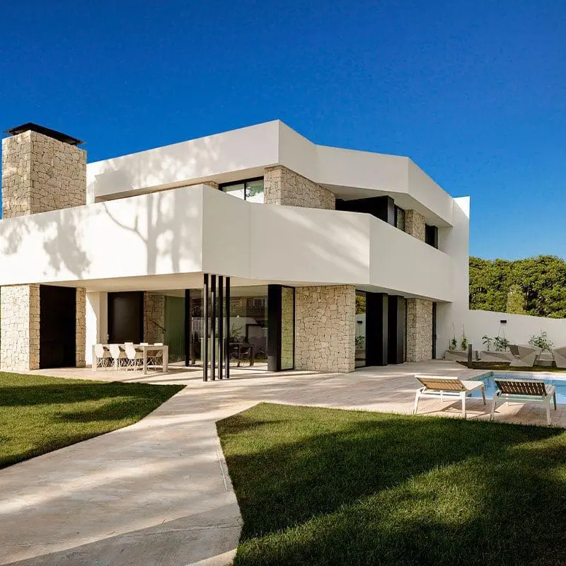 Residential project with outdoor furniture chairs, table and sun loungers by Vondom